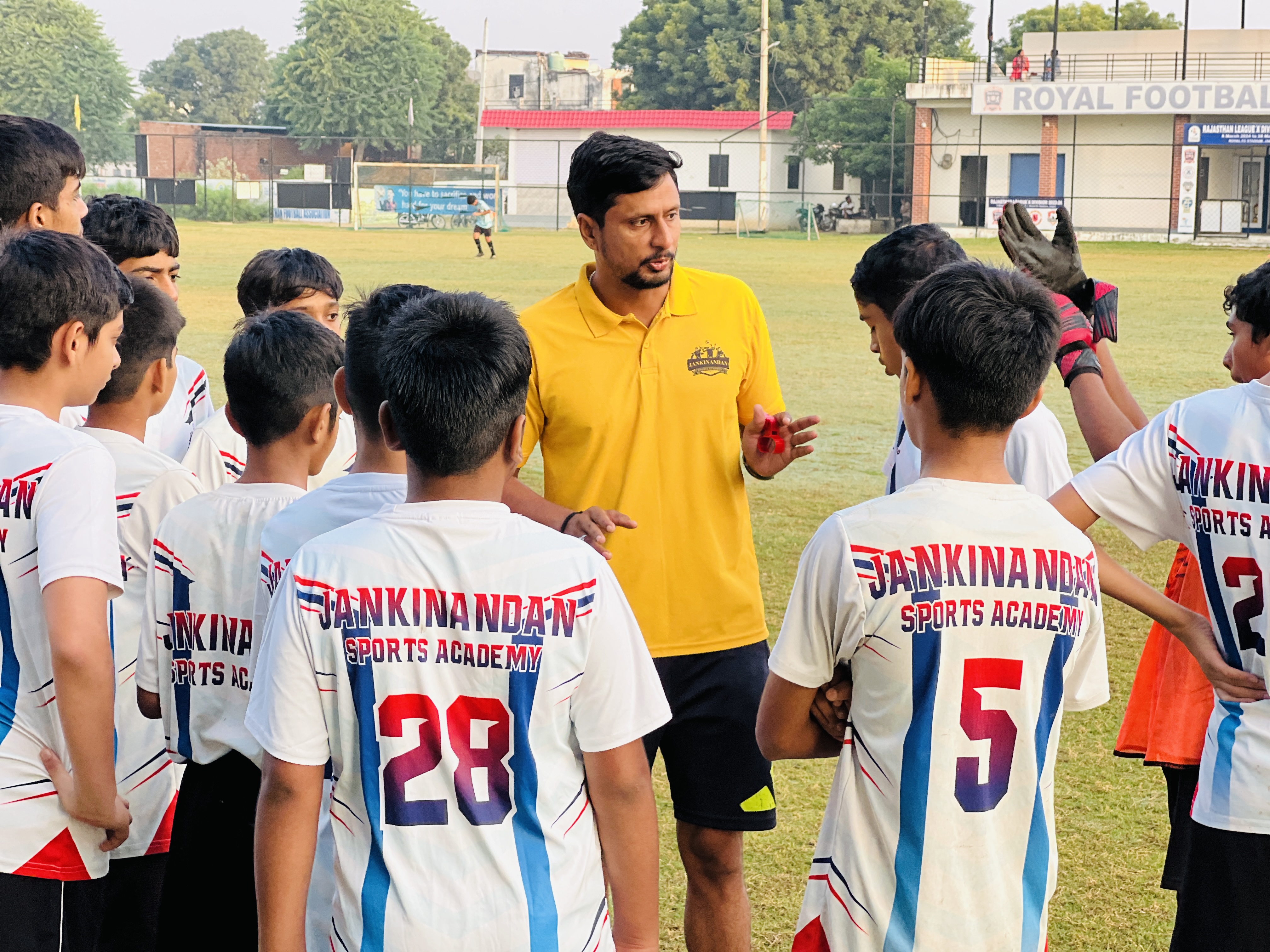 Coach briefing football squad